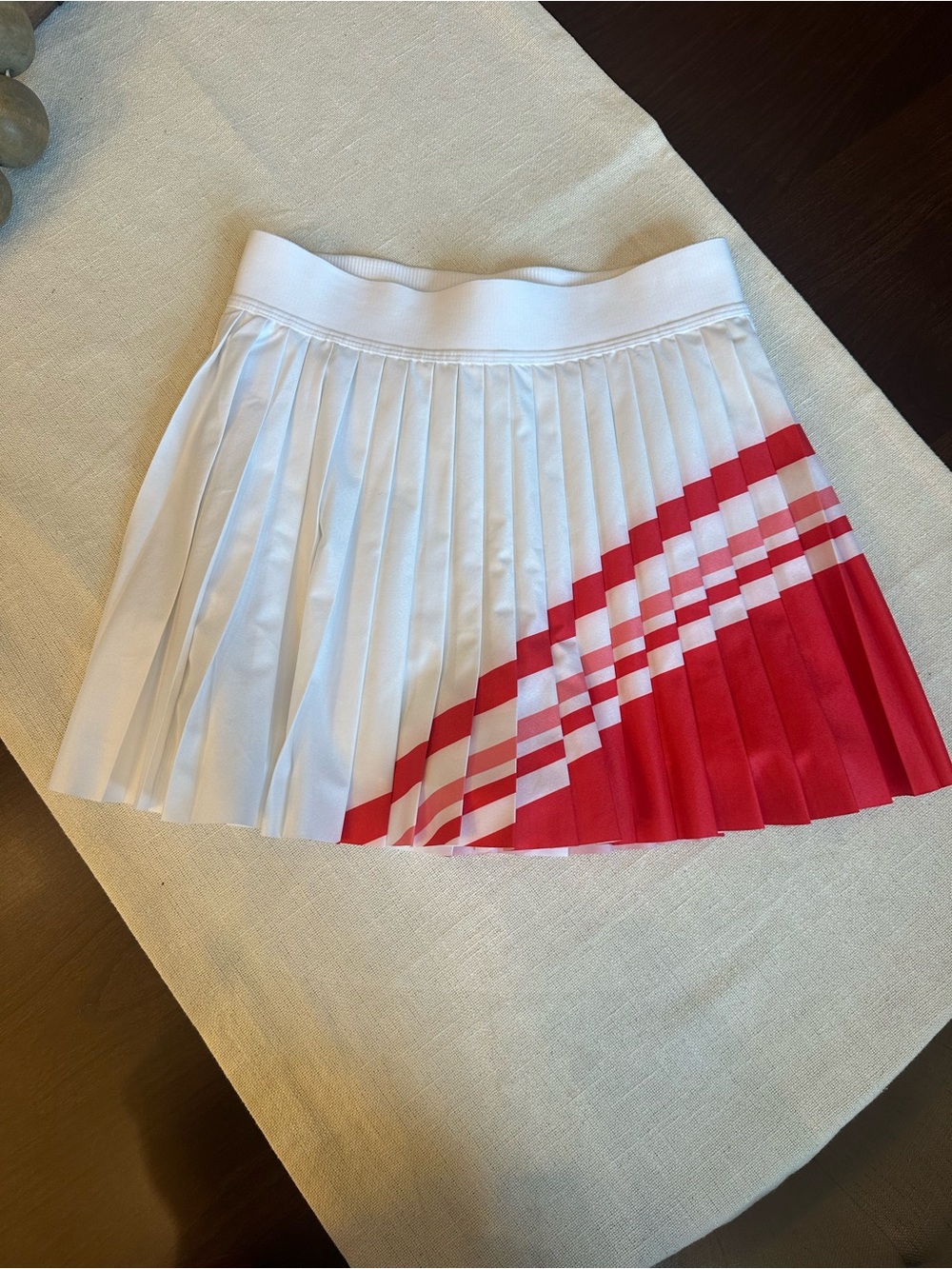Athleta White Pleated Mini Skirt with Red Chevron Accent